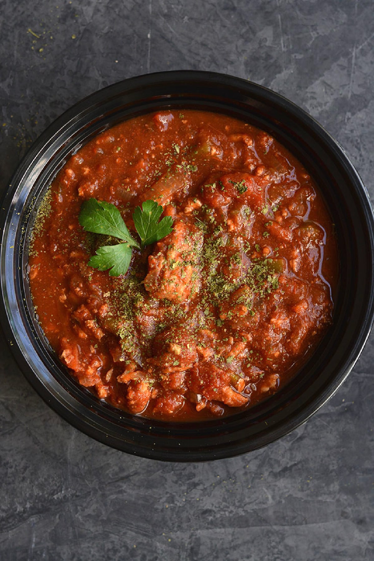 ground turkey chili in a black bowl.