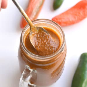 This Healthy Enchilada Sauce is made with homemade with wholesome, everyday ingredients. A simple to make, 10 minute enchilada sauce made easy on the stovetop with minimal work. Naturally gluten free, Paleo and low in calories. Perfect for topping enchiladas, tacos, burritos, salads and more! 