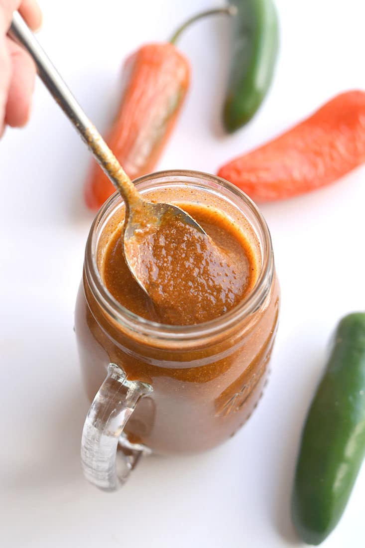 This Healthy Enchilada Sauce is made with homemade with wholesome, everyday ingredients. A simple to make, 10 minute enchilada sauce made easy on the stovetop with minimal work. Naturally gluten free, Paleo and low in calories. Perfect for topping enchiladas, tacos, burritos, salads and more! 