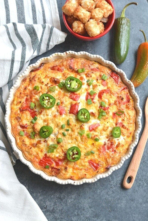 Tater Tot Breakfast Bake! Loaded with chicken, eggs, bell pepper & tater tots, this recipe is simple to make, hearty & tasty. Perfect for a weekend brunch and feeds a crowd too! Gluten Free + Low Calorie