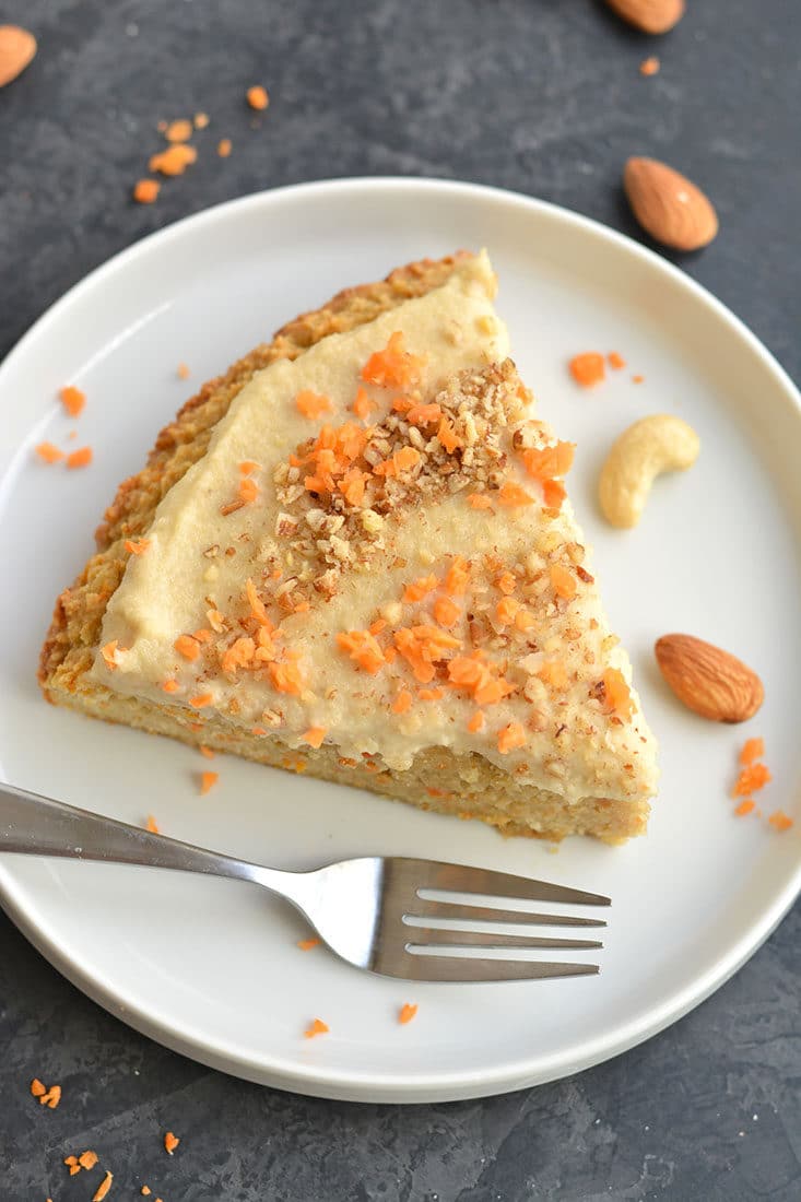 Paleo Almond Flour Carrot Cake! This carrot cake recipe is healthy super simple & quick to make. Topped with a cashew maple frosting that's irresistible. Soft, moist & dairy-free. Vegan option included! Paleo + Vegan