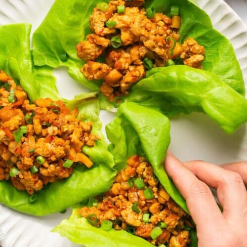 Meal Prep Healthy Chicken Lettuce Wraps! A Gluten Free appetizer or meal filled with spicy flavor! Minimal ingredients and quick to make. Perfect for an easy meal prep! Paleo + Gluten Free + Low Calorie