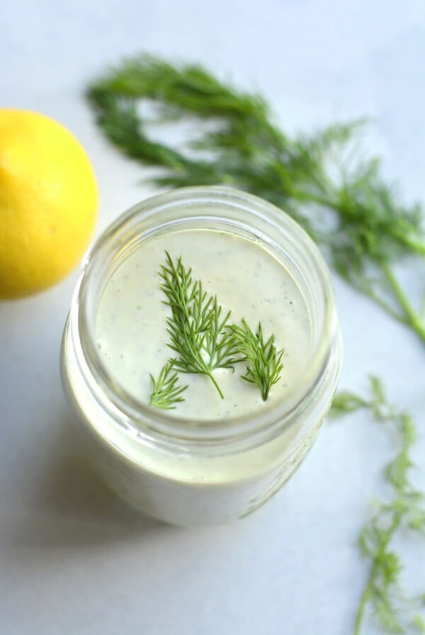 Greek Yogurt Ranch Dressing! This lightened up dressing is low in fat and calories and higher in protein. Made mayo free making this a healthier, waist friendly salad dressing. Top on salads, sandwiches or serve as a dip. Gluten Free + Low Calorie