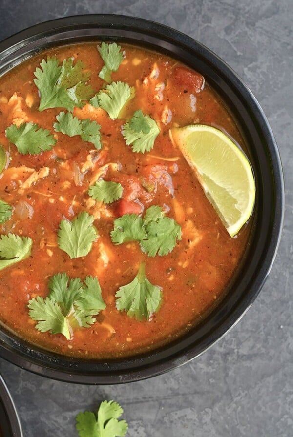 Meal Prep Chicken Tortilla Soup! A gluten free and Paleo soup that's nourishing and slightly spicy! Roasted then blended pasilla chilies and carrots give this soup amazing flavors. Made in 30 minutes in an Instant Pot with a stovetop option!