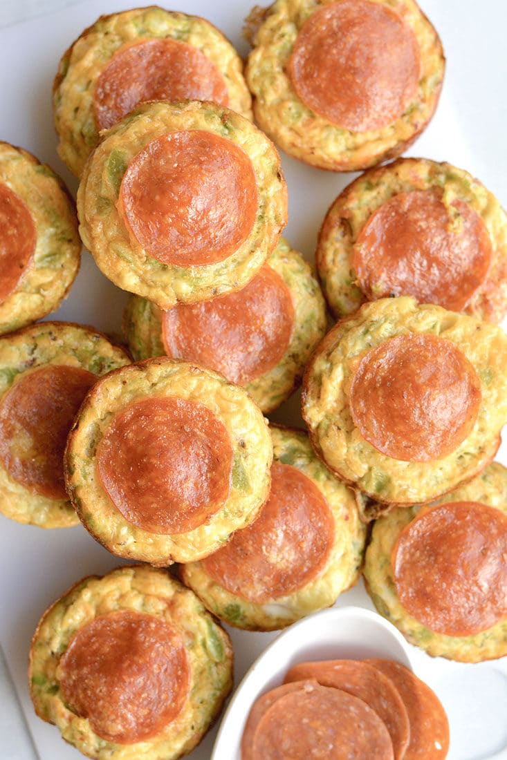 Skinny Pizza Egg Muffins! An easy recipe that makes a quick breakfast and healthy meal every morning. Packed with riced bell pepper and spices, these egg muffins are perfect for weekend meal prep. Wholesome, light and delicious! Gluten Free, Low Calorie, Paleo