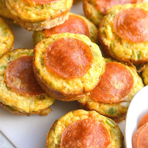 Skinny Pizza Egg Muffins! An easy recipe that makes a quick breakfast and healthy meal every morning. Packed with riced bell pepper and spices, these egg muffins are perfect for weekend meal prep. Wholesome, light and delicious! Gluten Free, Low Calorie, Paleo