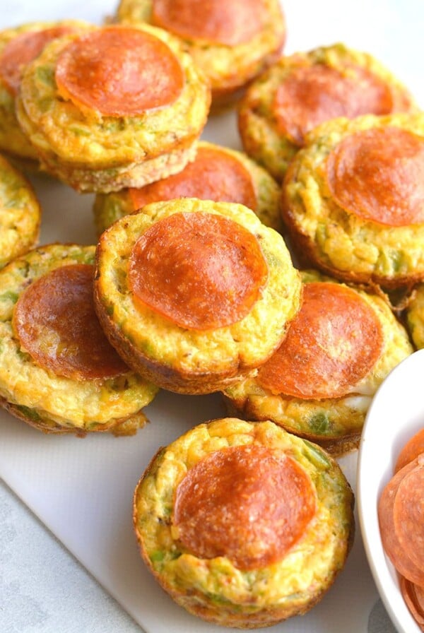 Skinny Pizza Egg Muffins! An easy recipe that makes a quick breakfast and healthy meal every morning. Packed with riced bell pepper and spices, these egg muffins are perfect for weekend meal prep. Wholesome, light and delicious! Gluten Free, Low Calorie, Paleo