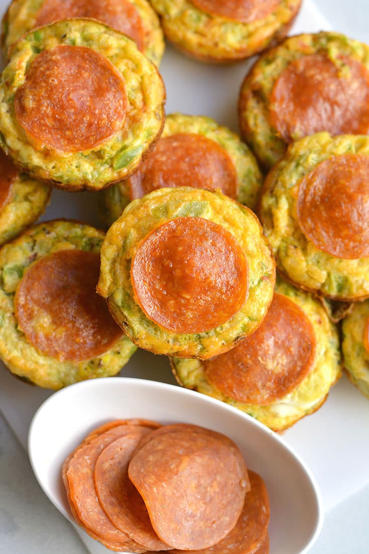 Skinny Pizza Egg Muffins! An easy recipe that makes a quick breakfast and healthy meal every morning. Packed with riced bell pepper and spices, these egg muffins are perfect for weekend meal prep. Wholesome, light and delicious! Gluten Free, Low Calorie, Paleo
