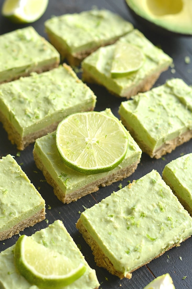 Avocado Key Lime Pie Bars! Made with a buttery gluten free oat crust that tastes like graham crackers and topped with creamy lime avocado Greek yogurt filling for an irresistible treat! A lighter twist on Key Lime Pie that's made with healthier ingredients and balanced in nutrition. Gluten Free + Low Calorie