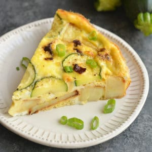 This Lightened Up Spanish Tortilla is loaded with sweet potatoes, zucchini and sun dried tomatoes. A new & lighter twist on a Spanish Tortilla that's easy to make. It's wholesome, light and delicious! Perfect for a holiday, weekend brunch or breakfast meal prep. Paleo + Gluten Free + Low Calorie