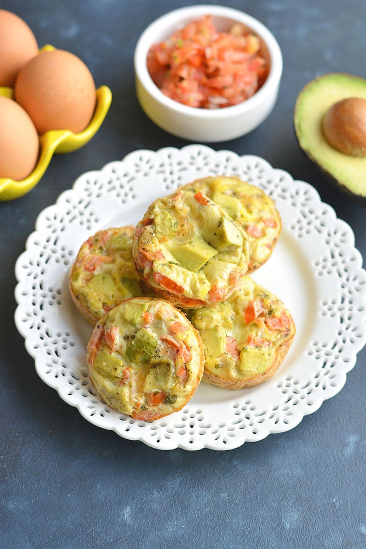 Tex-Mex Avocado Egg Muffins! Made with salsa and avocado, these egg cups make a nutritious low carb breakfast. Easy to make ahead of time and warm up on the go! Low Carb + Paleo + Gluten Free + Low Calorie