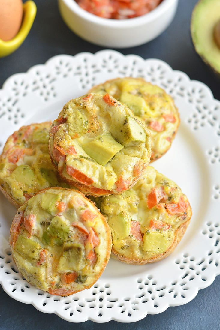 Tex-Mex Avocado Egg Muffins! Made with salsa and avocado, these egg cups make a nutritious low carb breakfast. Easy to make ahead of time and warm up on the go! Low Carb + Paleo + Gluten Free + Low Calorie