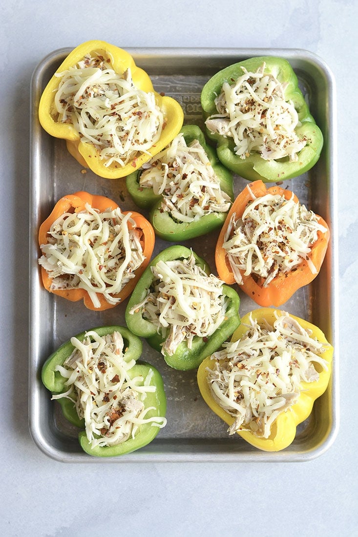 Meal Prep Chicken Philly Cheesesteak! This low carb recipe makes juicy and flavorful shredded chicken in an Instant Pot in 30 minutes and broils it in bell peppers with a touch of cheese on top! An easy, lunch or dinner to make ahead. Low Carb + Gluten Free + Low Calorie