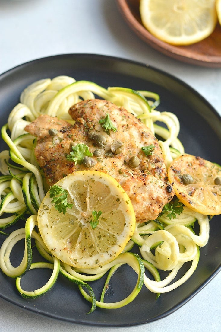 Lemon Chicken Piccata Zucchini Noodles! An easy, one skillet meal that adds tons of flavor to chicken. Served over zucchini noodles for a lighter, low carb twist on lemon piccata. All the flavor without all the calories! Paleo + Low Calorie + Low Carb + Gluten Free 