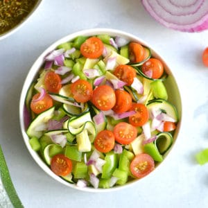 Paleo Zucchini Pasta Salad! Replace pasta with spiralized zucchini for a light, refreshing and filling pasta salad! A low carb pasta salad filled with vegetables. Pair with your favorite lean protein for a complete meal. Low Carb + Gluten Free + Paleo + Low Calorie + Vegan