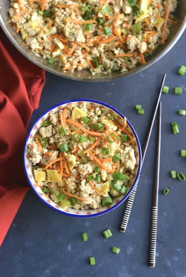Meal Prep Chicken Cauliflower Fried Rice! Cauliflower rice replaces the grains in this low carb dish. Naturally gluten free, a good source of veggies and incredibly delicious! Low Carb + Paleo + Gluten Free