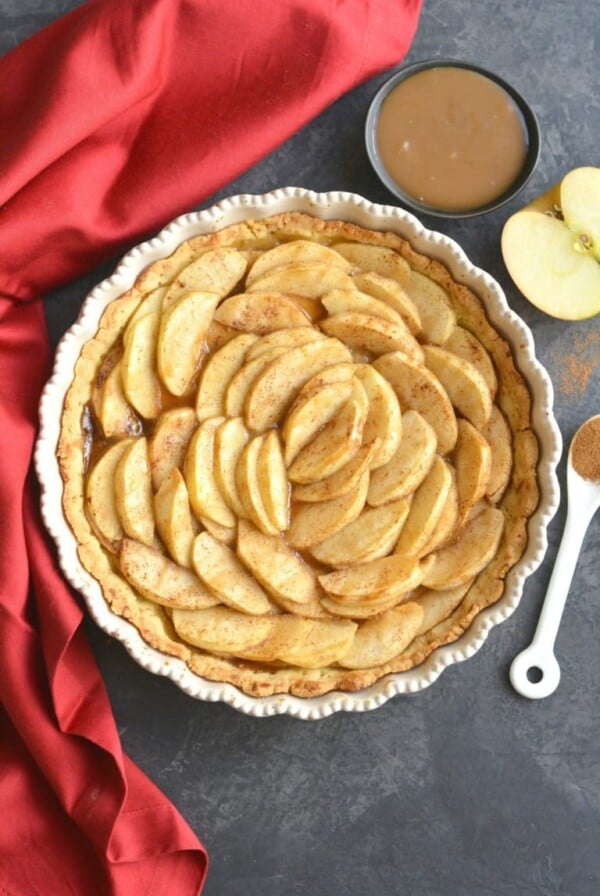 This Almond Flour Apple Pie features an easy to make almond flour crust with sliced apples on top. A dessert recipe that comes together easily, is family approved, Paleo, gluten free and grain free. 