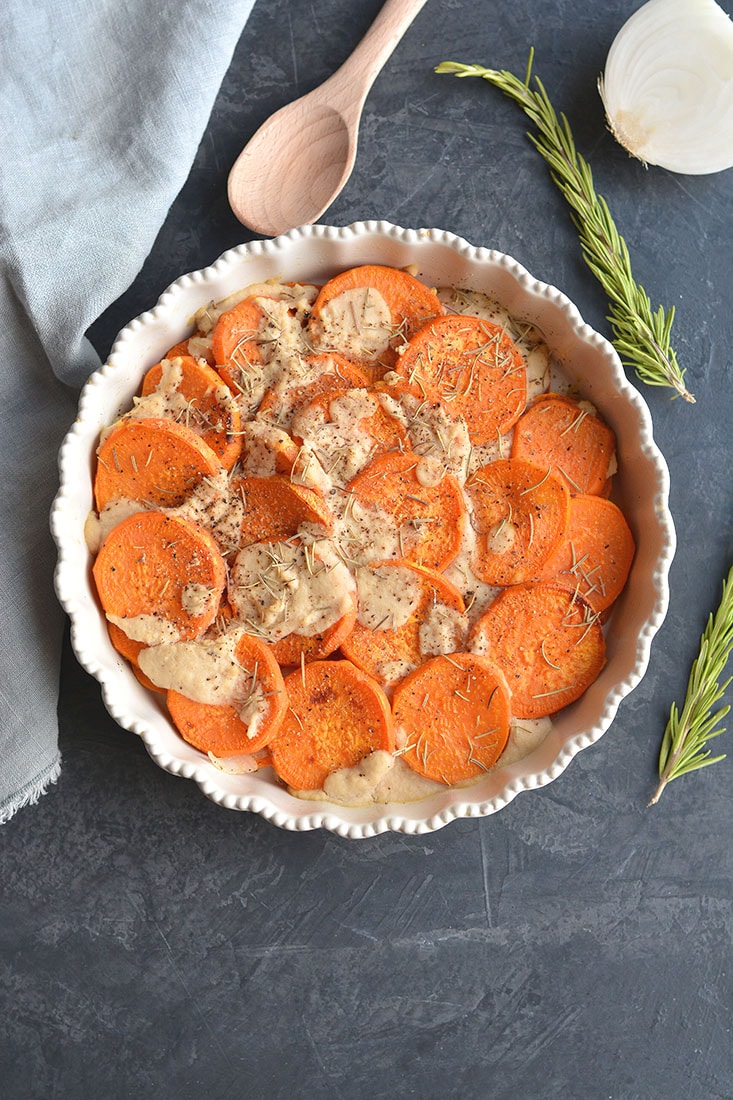 Whole30 Sweet Potato Au Gratin are sweet potatoes drizzled in a dairy-free cashew "cream" sauce. This Vegan and Paleo dish makes an easy side dish to a family dinner or a delicious to your holiday table. 