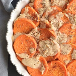 Whole30 Sweet Potato Au Gratin are sweet potatoes drizzled in a dairy-free cashew "cream" sauce. This Vegan and Paleo dish makes an easy side dish to a family dinner or a delicious to your holiday table.
