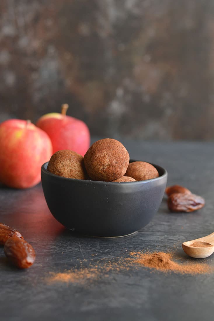 Vegan Apple Cinnamon Peanut Butter Bites! Simple, no bake energy bites with a soft, cookie like texture with the sweetness of cinnamon. Made with good for you ingredients and refined sugar free. A healthy snack the whole family will love! Vegan + Low Calorie + Gluten Free