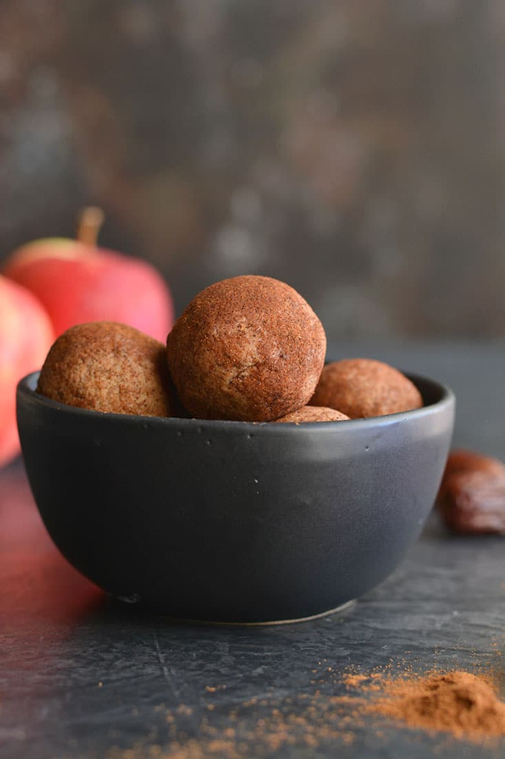 Vegan Apple Cinnamon Peanut Butter Bites! Simple, no bake energy bites with a soft, cookie like texture with the sweetness of cinnamon. Made with good for you ingredients and refined sugar free. A healthy snack the whole family will love! Vegan + Low Calorie + Gluten Free