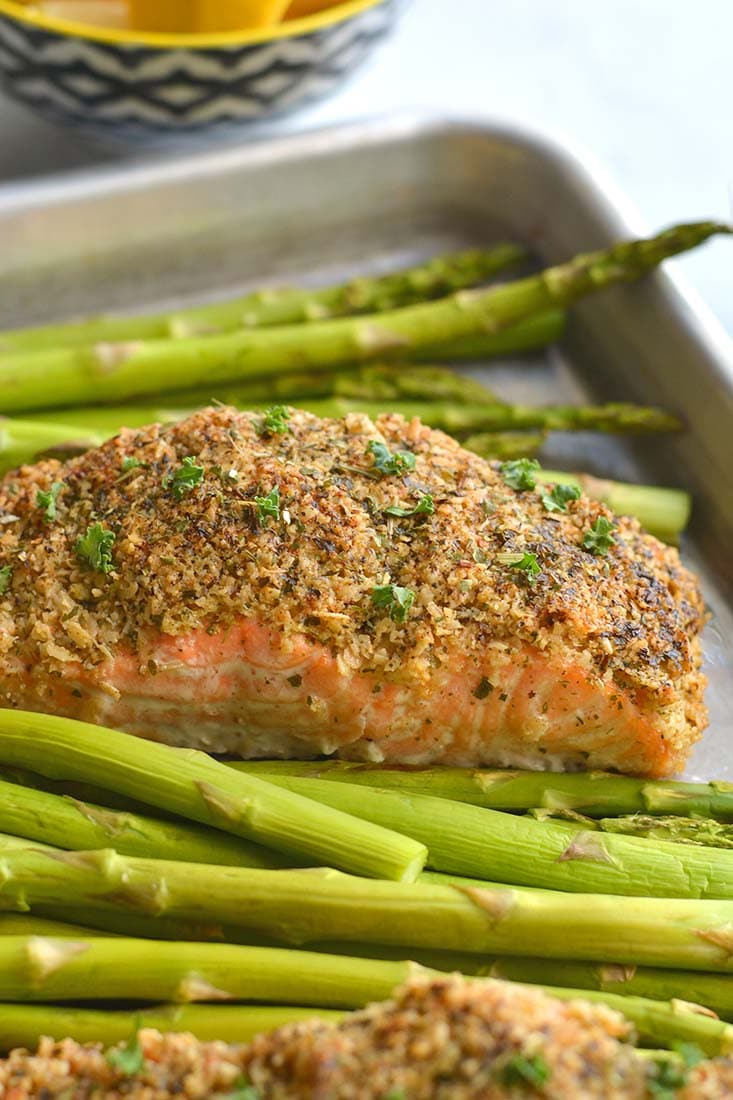 Crispy Oven Fried Salmon! Salmon crusted with gluten free oats, parsley and parmesan and baked on a sheet pan to crispy perfection. An healthy, gluten free weeknight meal! Low Calorie + Gluten Free