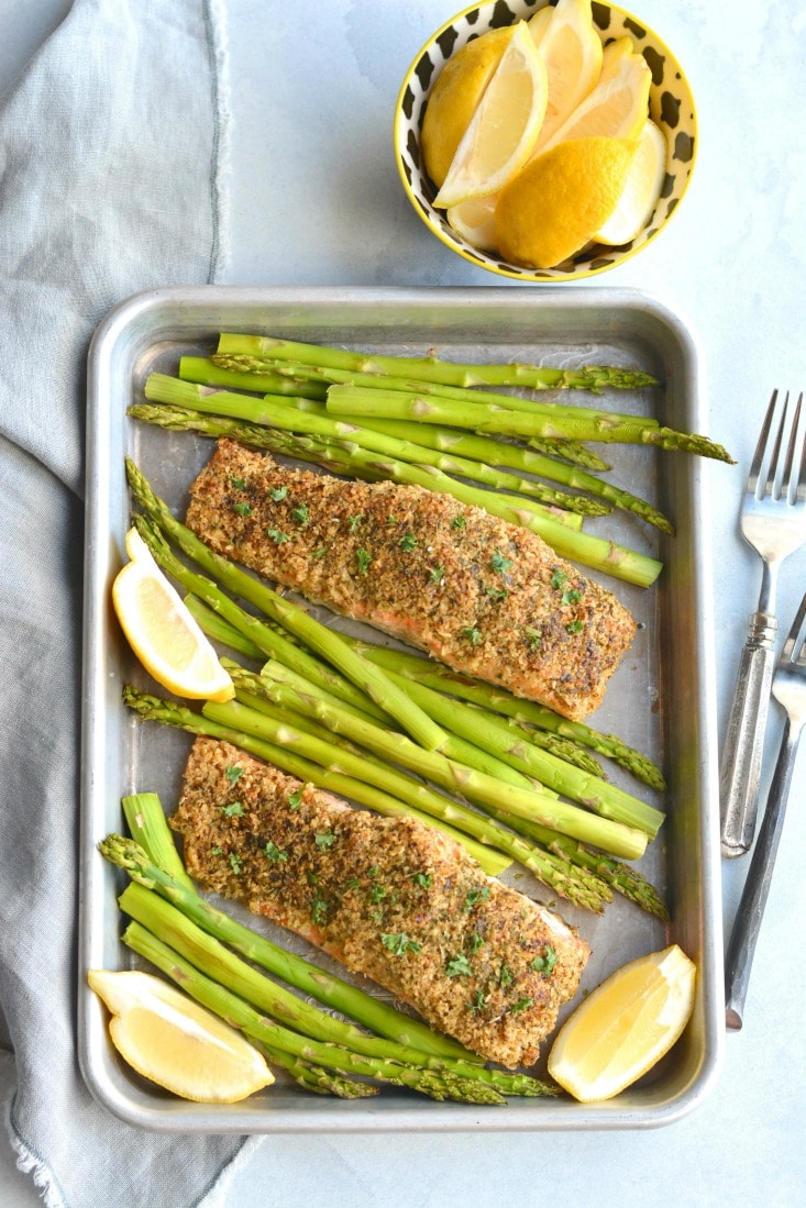 Crispy Oven Fried Salmon! Salmon crusted with gluten free oats, parsley and parmesan and baked on a sheet pan to crispy perfection. An healthy, gluten free weeknight meal! Low Calorie + Gluten Free
