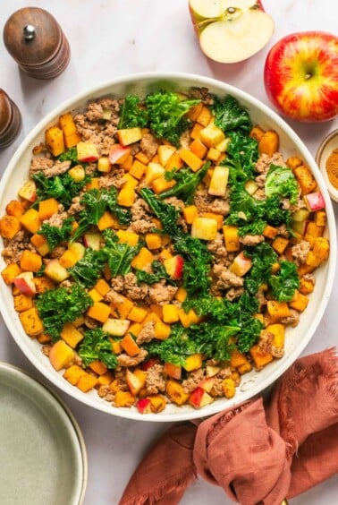This Butternut Squash Breakfast Hash is loaded with nourishment and has the perfect balance of sweet and savory flavors. High protein, this is a delicious breakfast without the eggs! Whole30 + Paleo + Gluten Free + Low Calorie