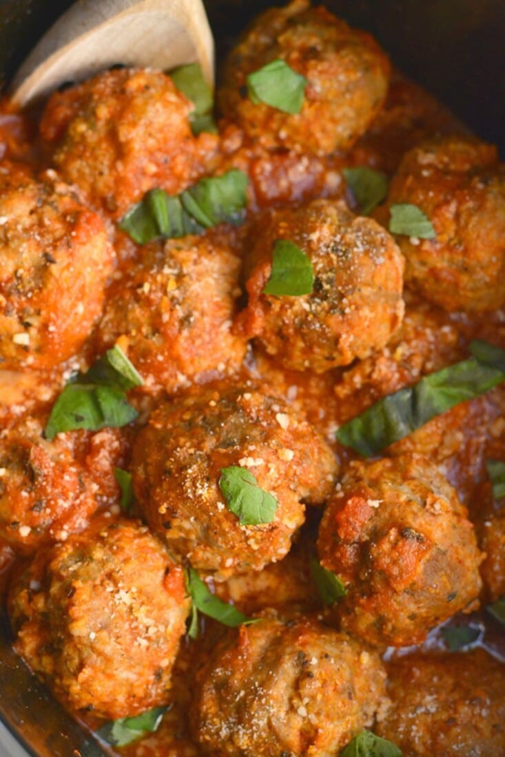Turkey meatballs in a red sauce in a crockpot.