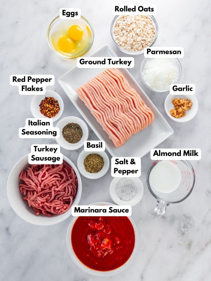 Ingredients to make ground turkey meatballs in bowls.