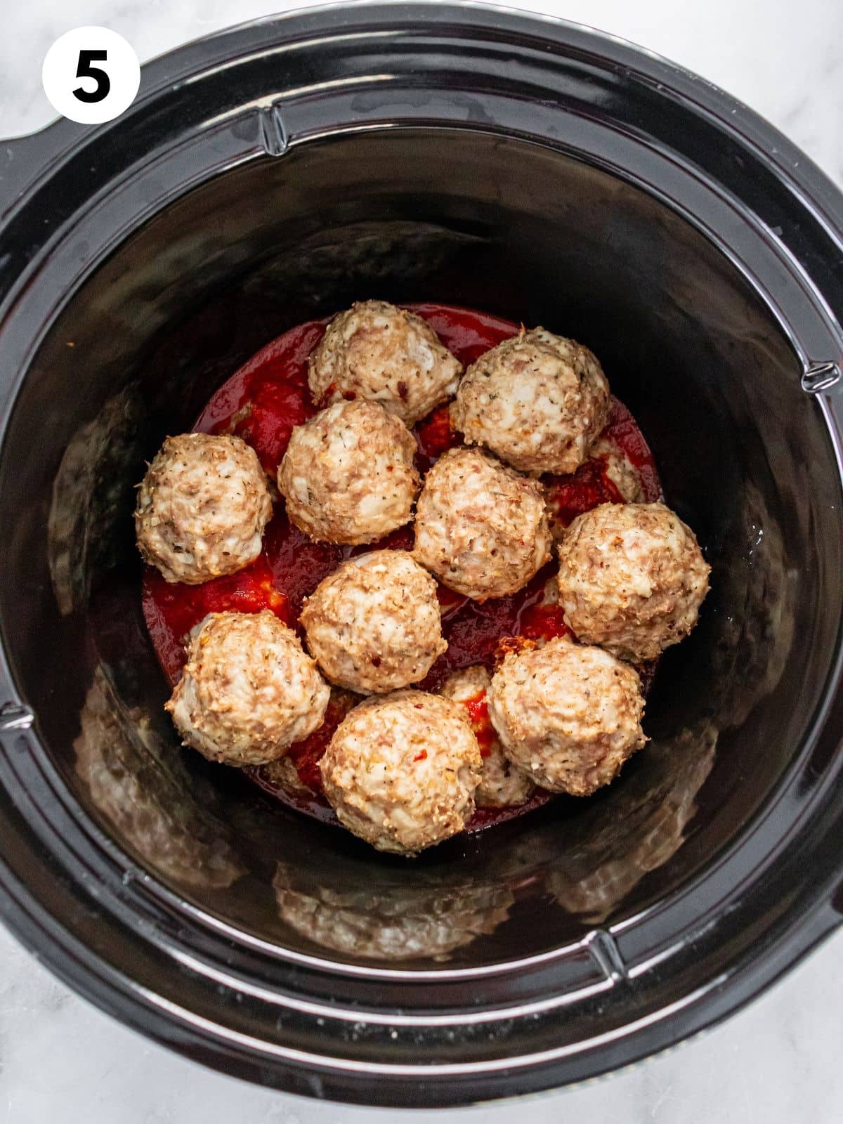 Turkey meatballs and sauce loaded up in a crockpot.