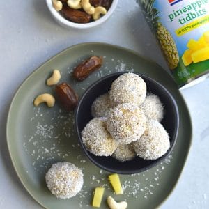 Coconut Cashew Pineapple Bites! These gluten free bites with a sweet pineapple inside and crunchy coconut cashew outside are the perfect bite sized snack! Paleo + Vegan + Gluten Free + Low Calorie