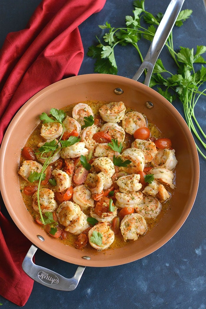 Healthy Shrimp Scampi Spaghetti Squash! Packed with flavor and simple to make. A lower carb meal with more nutrition and a lightened up the sauce! 