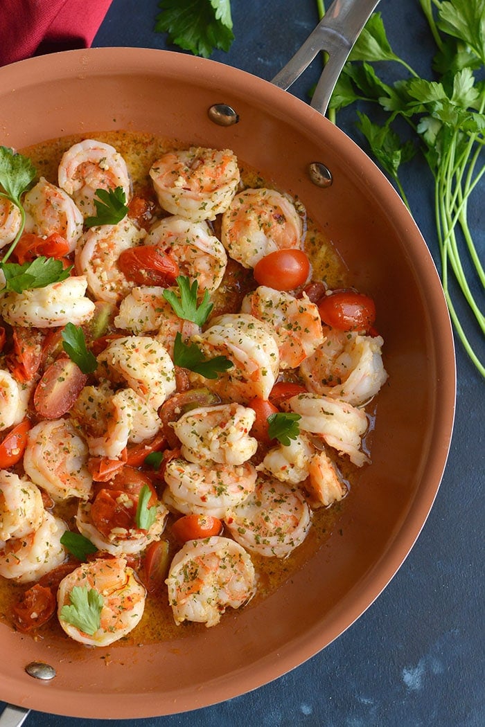 Healthy Shrimp Scampi Spaghetti Squash! Packed with flavor and simple to make. A lower carb meal with more nutrition and a lightened up the sauce! 