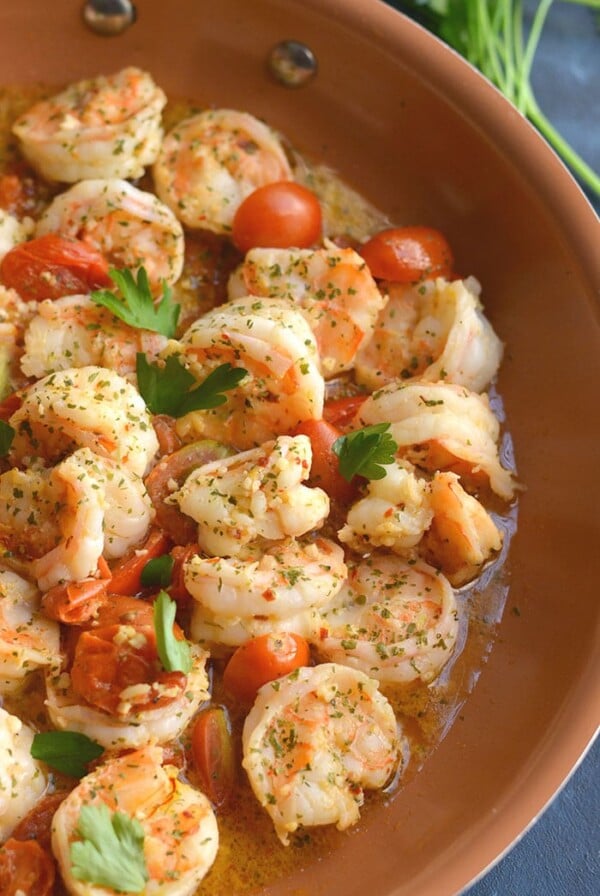 Paleo Shrimp Scampi Spaghetti Squash! Packed with flavor and simple to make. A lower carb meal with more nutrition and a lightened up the sauce!