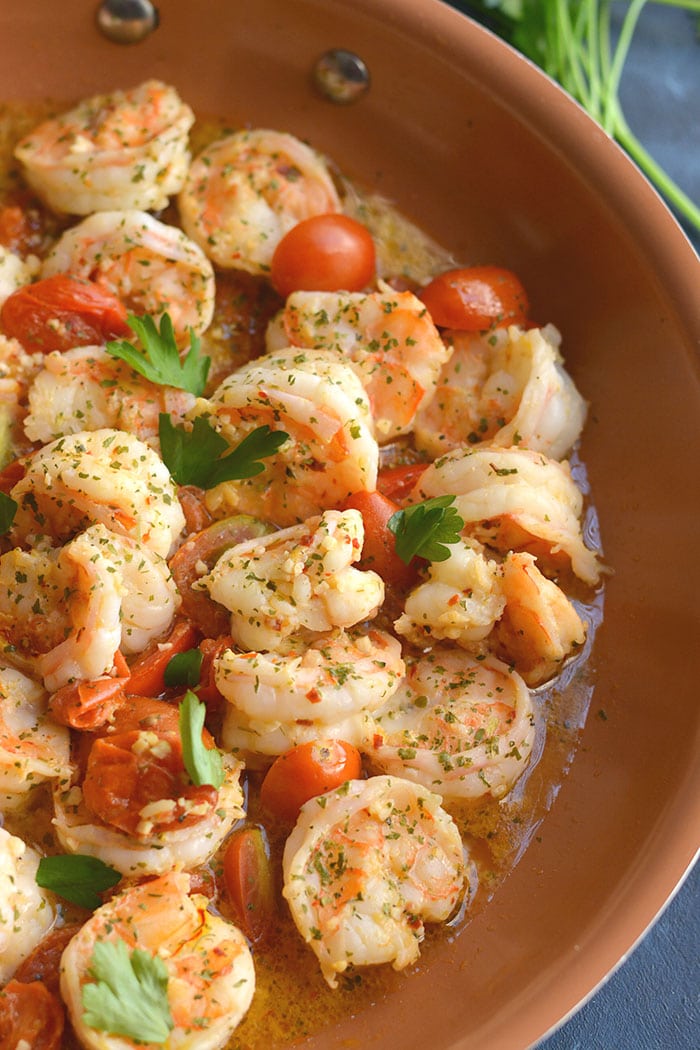 Healthy Shrimp Scampi Spaghetti Squash! Packed with flavor and simple to make. A lower carb meal with more nutrition and a lightened up the sauce! 