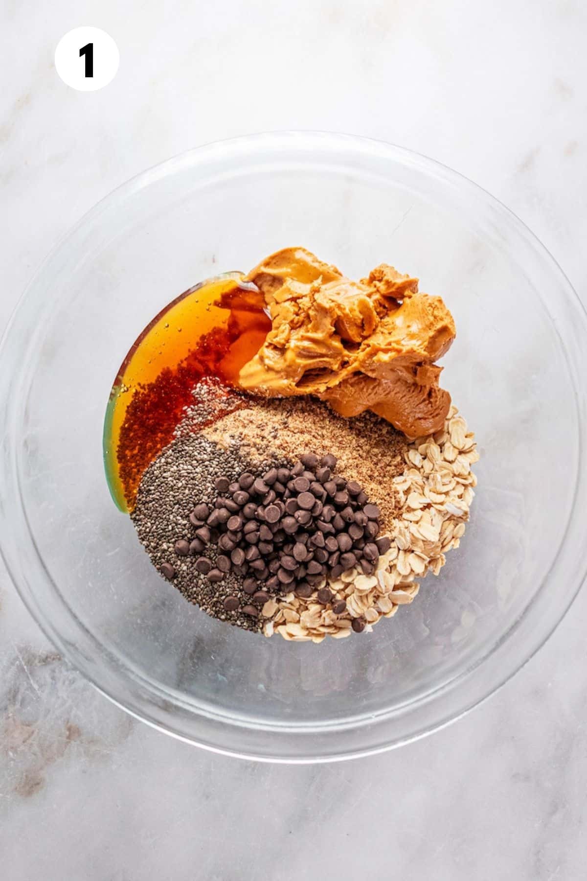 Ingredients to make almond butter protein balls in a bowl. 
