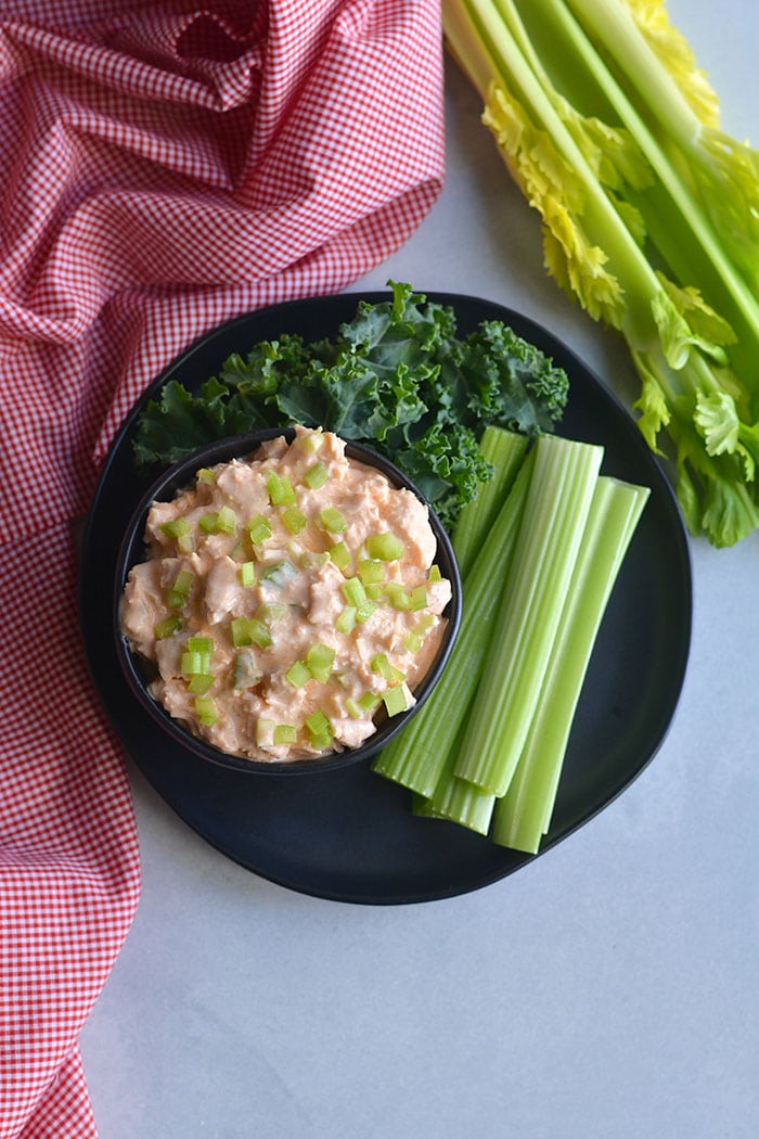 Low Carb Greek Yogurt Buffalo Chicken Salad! High protein and takes minutes to make. Only 4 ingredients! An easy meal prep lunch you can toss over a salad, on bread, in a wrap or tortilla. Low Carb + Gluten Free + Low Calorie