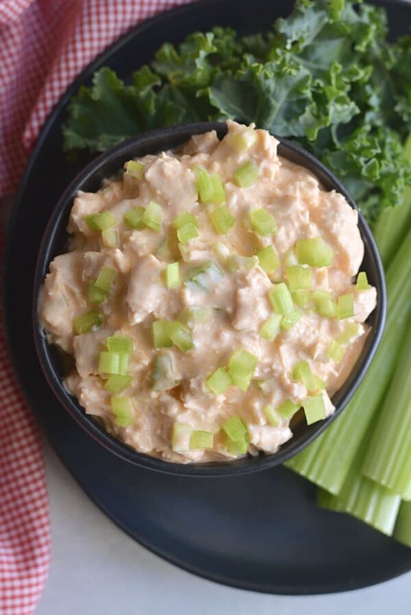Low Carb Greek Yogurt Buffalo Chicken Salad! High protein and takes minutes to make. Only 4 ingredients! An easy meal prep lunch you can toss over a salad, on bread, in a wrap or tortilla. Low Carb + Gluten Free + Low Calorie