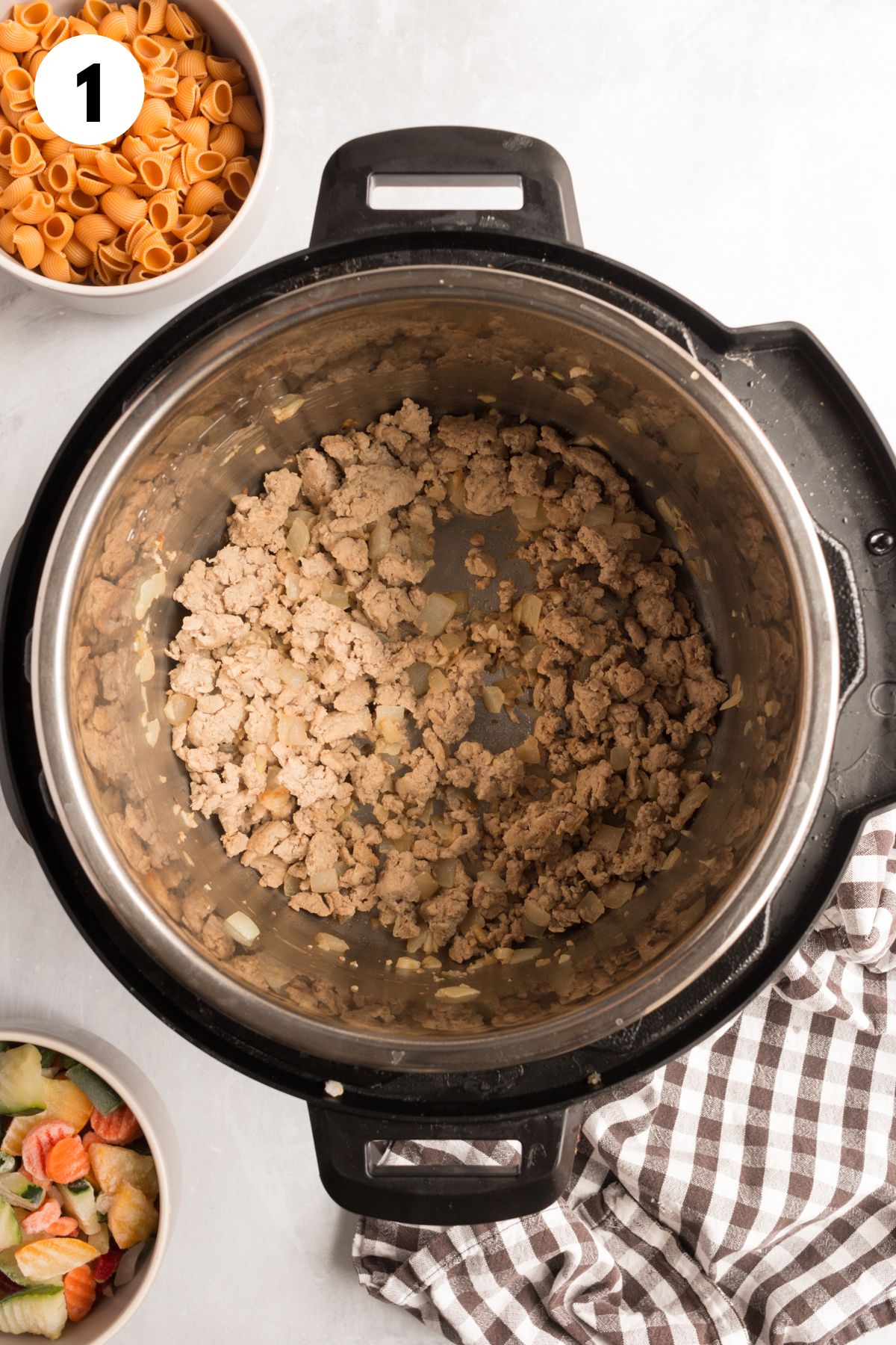 Cooking the ground turkey in the instant pot.