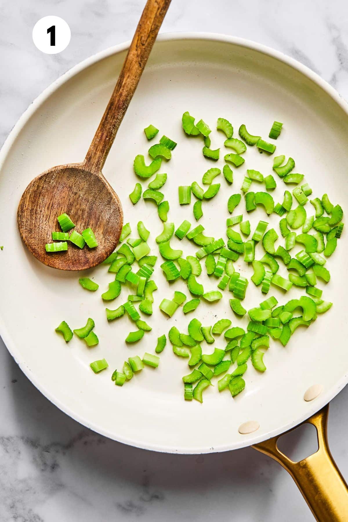 Chopped celery in a pan.
