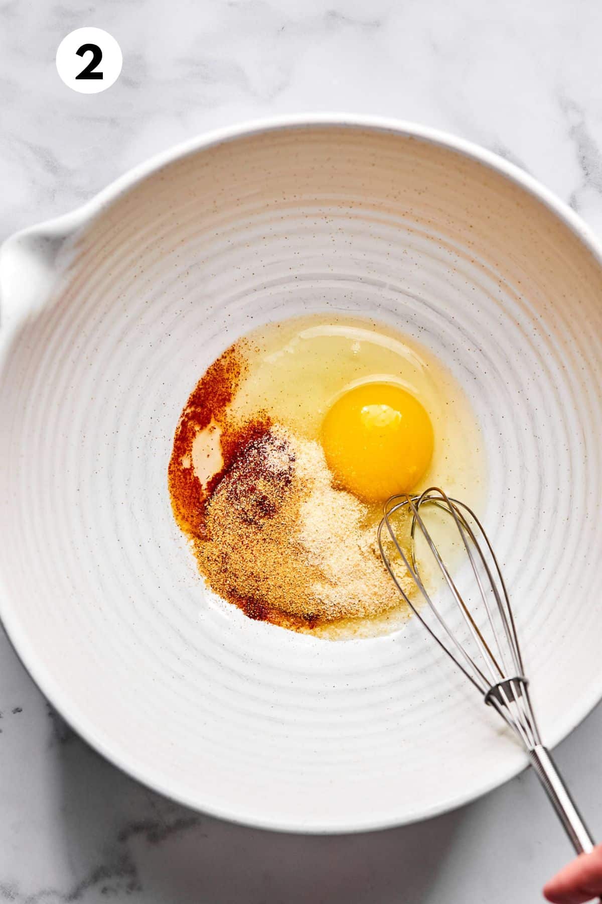 Egg and spices in a pan.