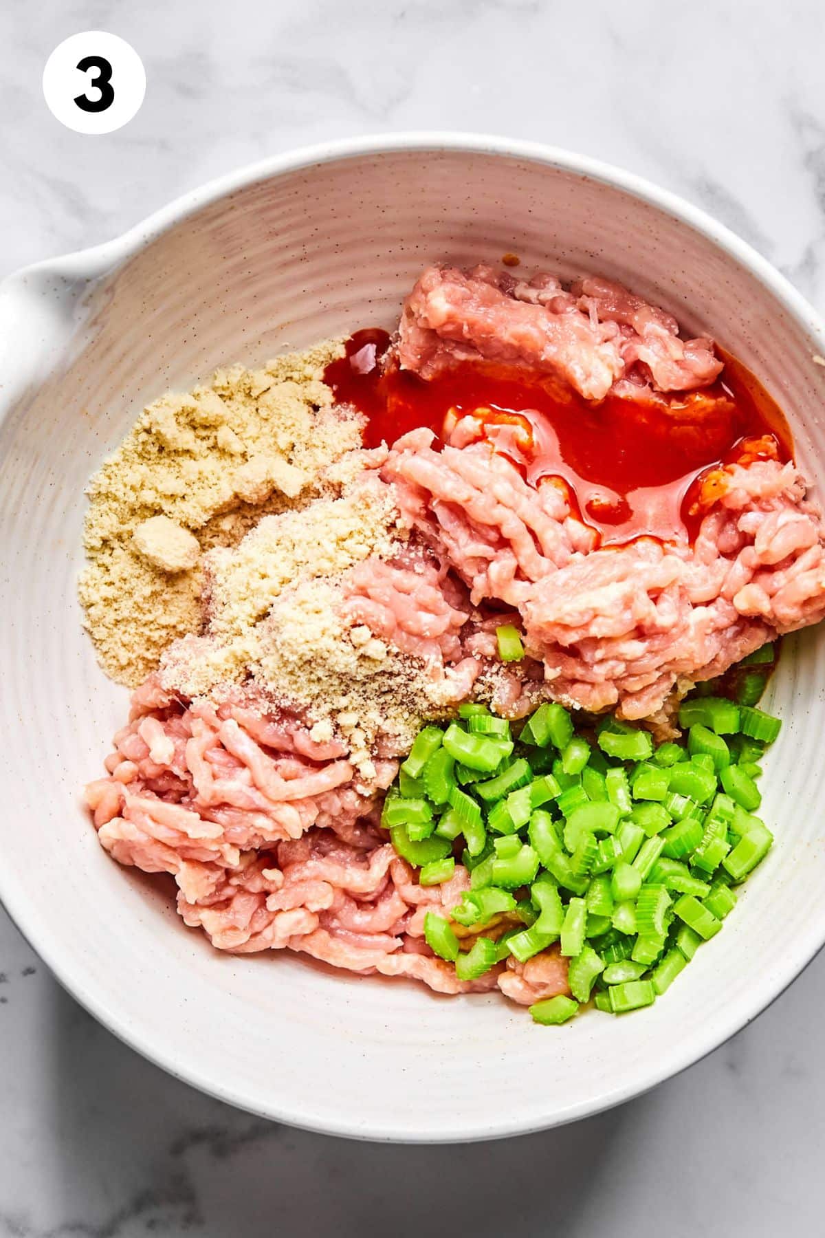 Ingredients for making this meatloaf together in a bowl.