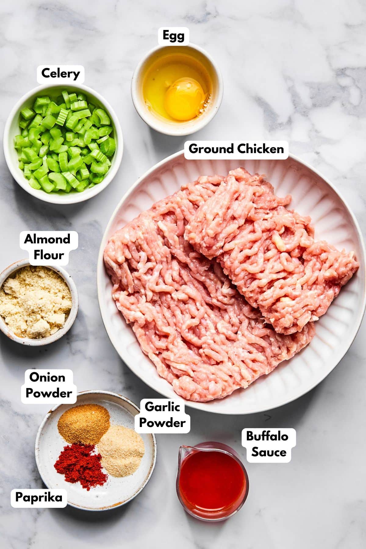 Ingredients for making buffalo chicken meatloaf on a table.