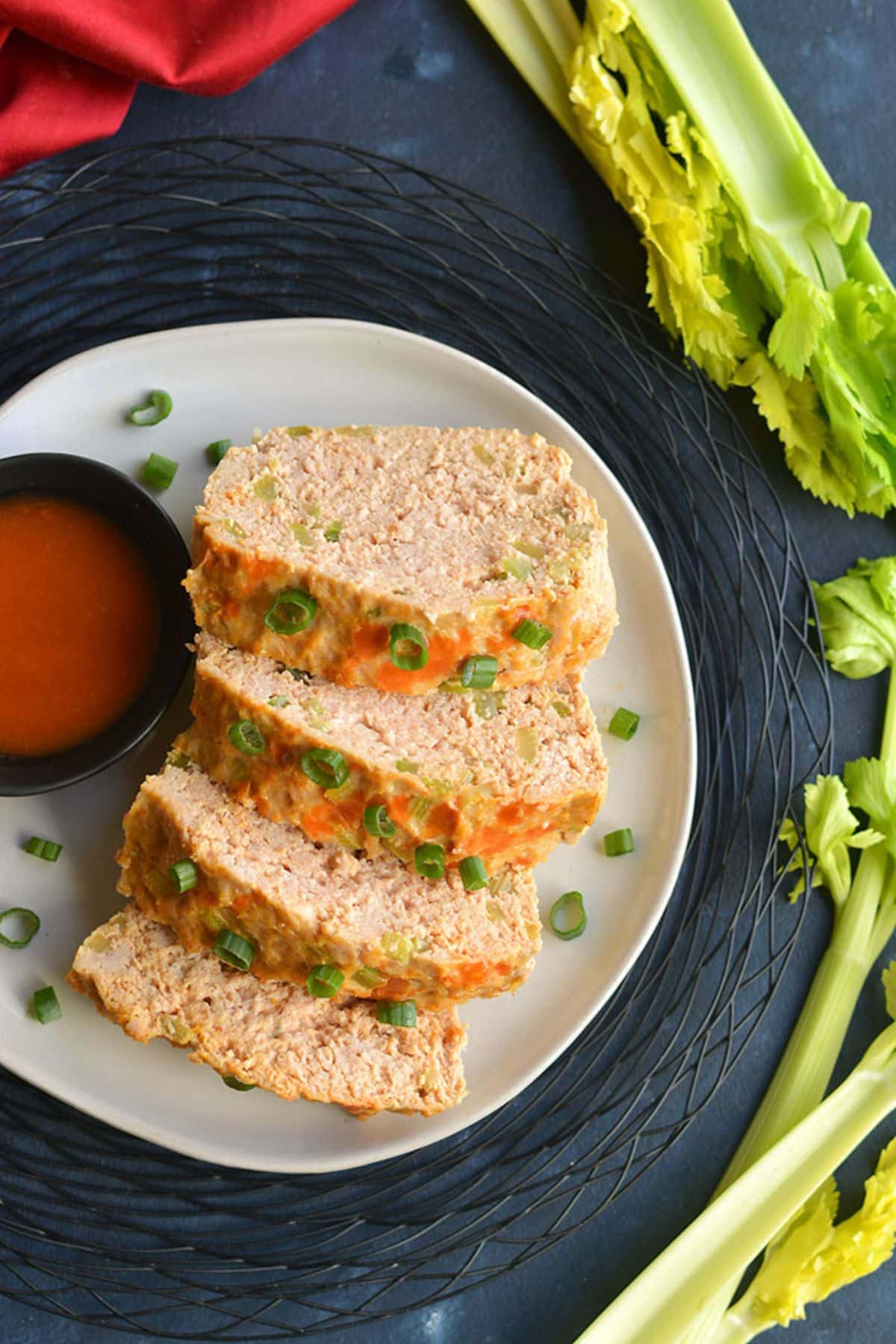 Sliced buffalo chicken meatloaf on a plate.