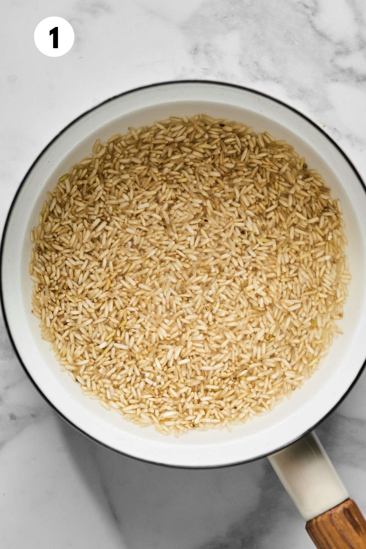 Rice and water in a pot to cook.