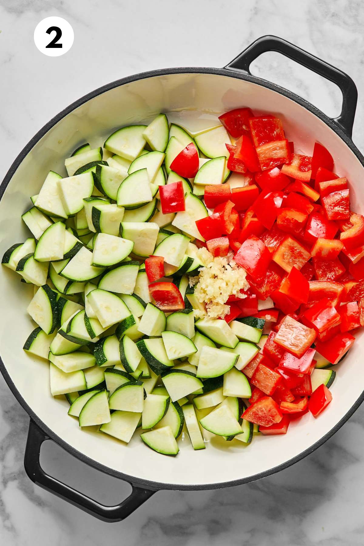 Vegetables cooking in a skillet.