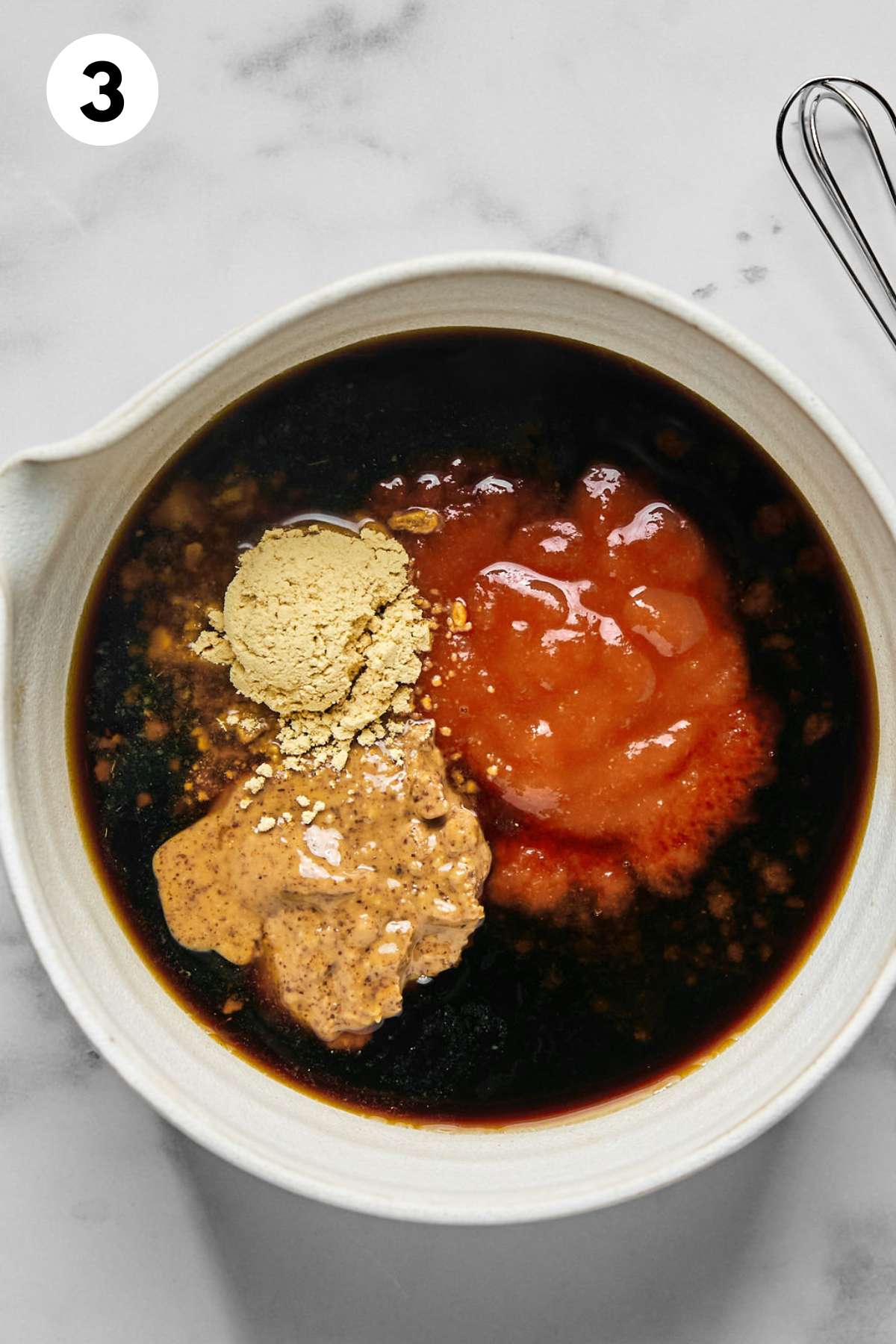 Sauce ingredients added to a bowl.