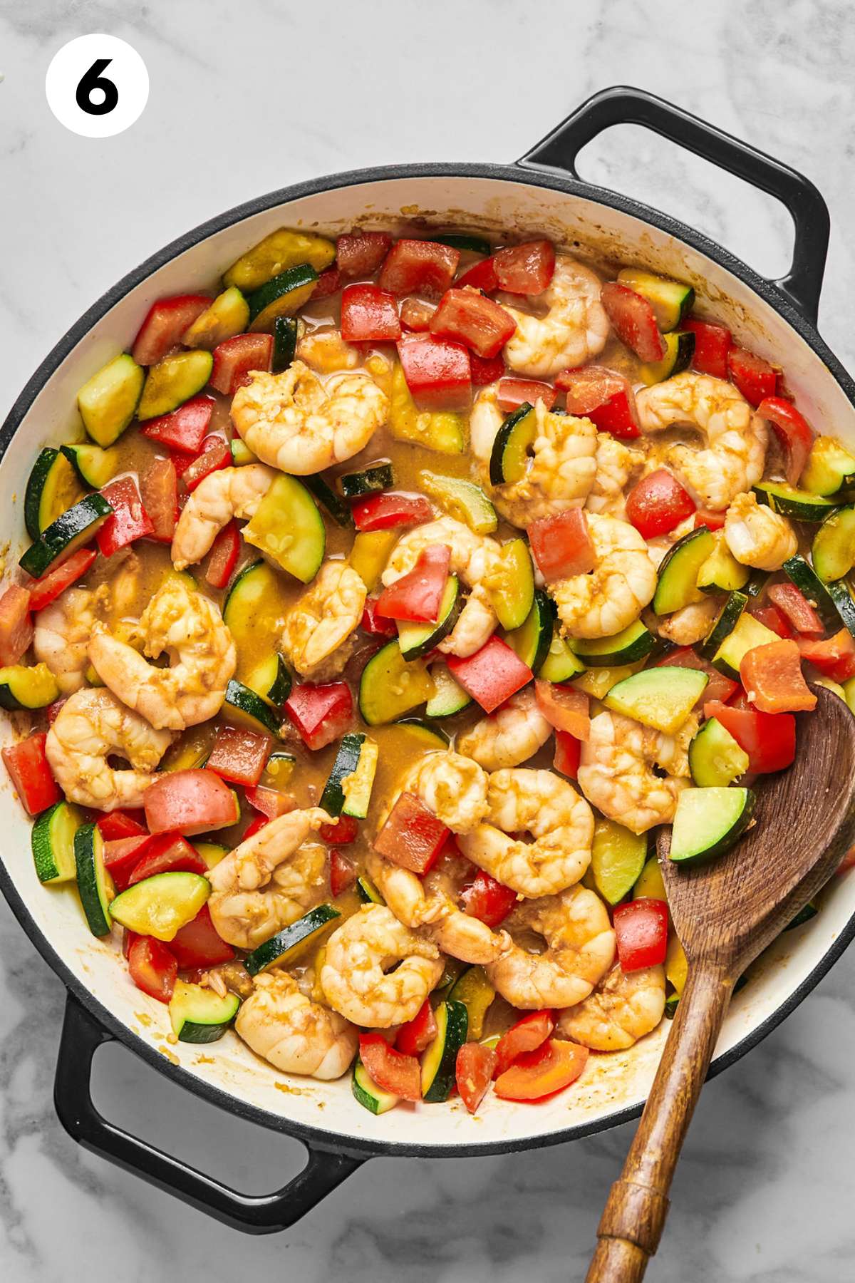 Kung pao shrimp cooked in a skillet.