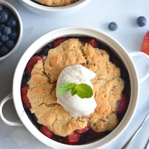 Paleo Berry Cobbler! An irresistible dessert with a delicious almond flour topping! Dairy free, Vegan friendly, easy to make and customize too!